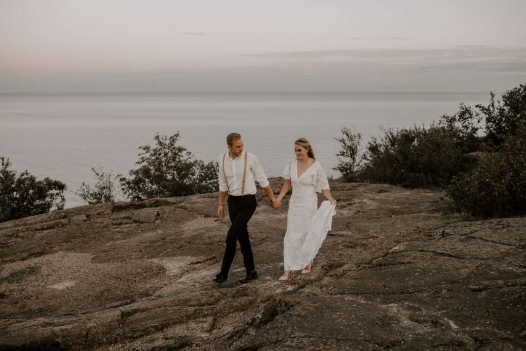 Couple Walking On Cliff for Northern Minnesota Palisade Head Elopement