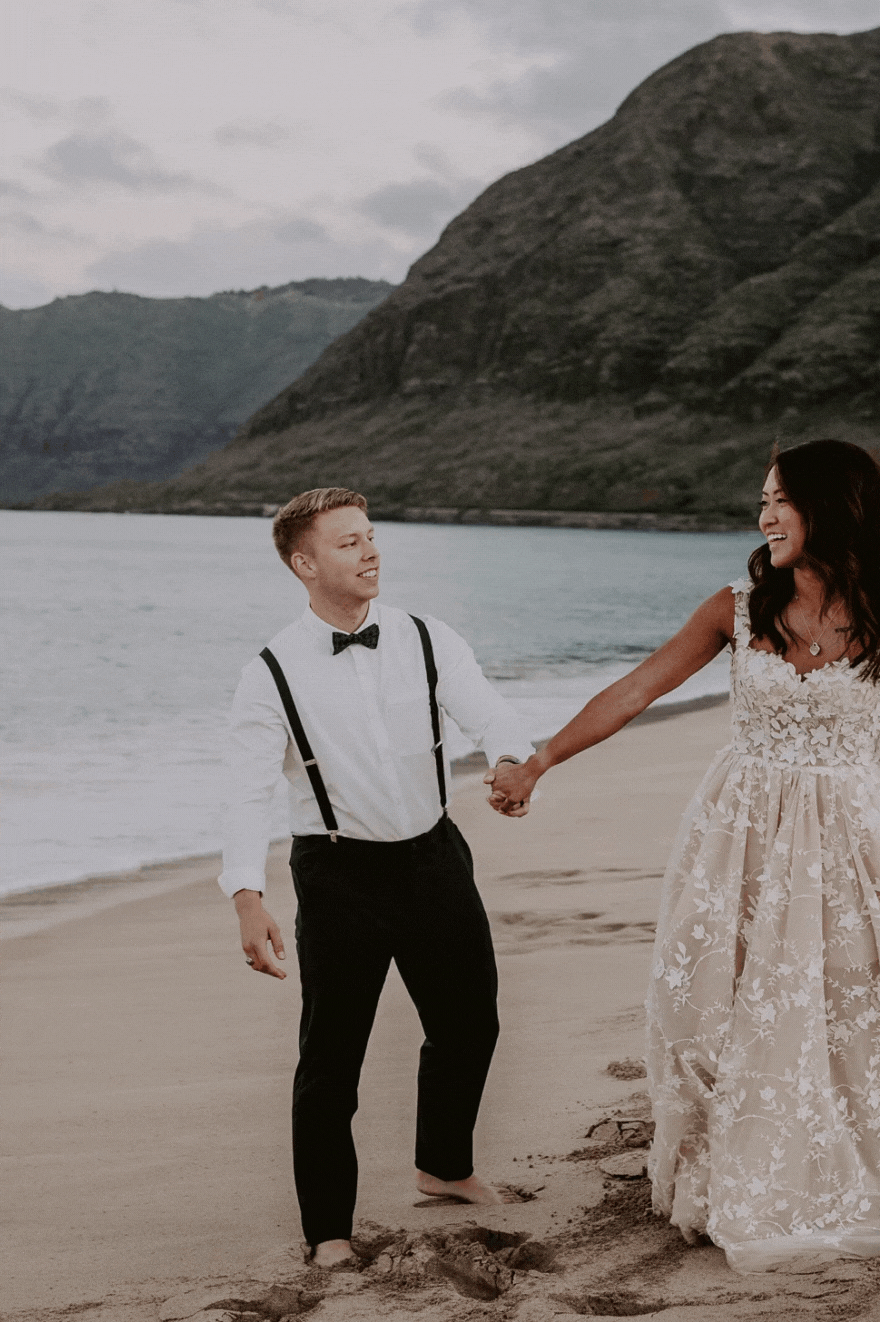 Bride and Groom Getting Comfortable and Cozy on Makua Beach on the Island of Oahu in Hawaii