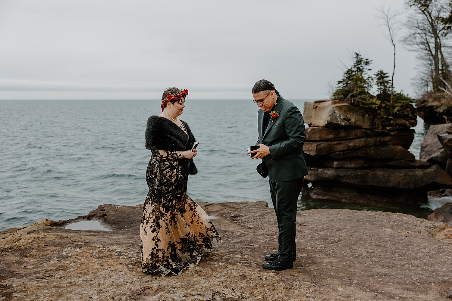 man opens book to read vows in private ceremony for Beltane Elopement
