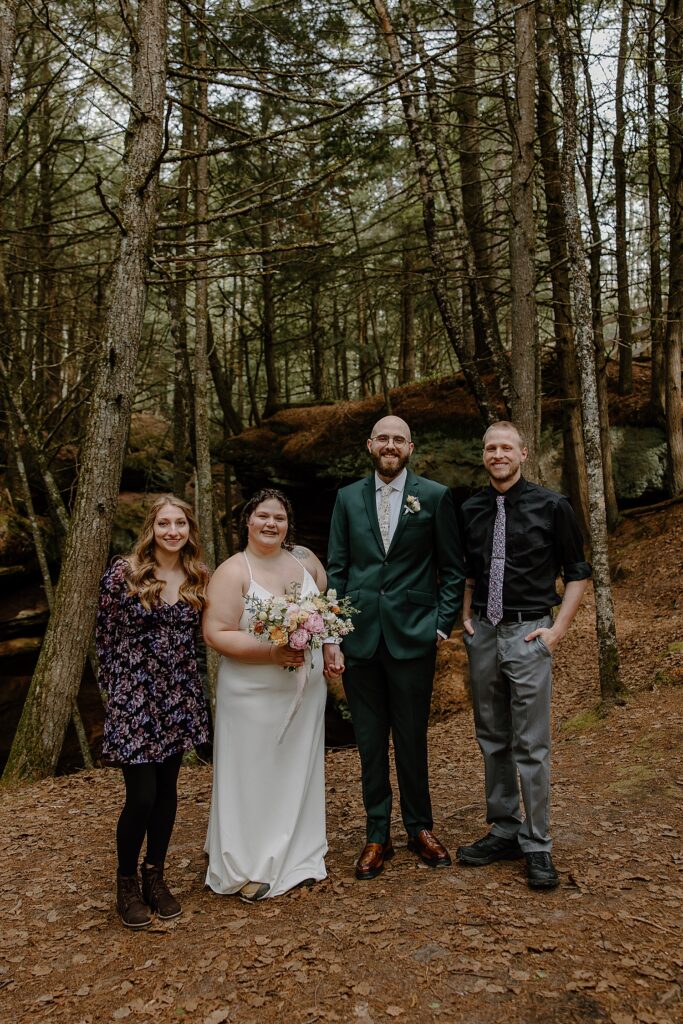 couple with their witnesses stand outside by Samantha Burke Photography