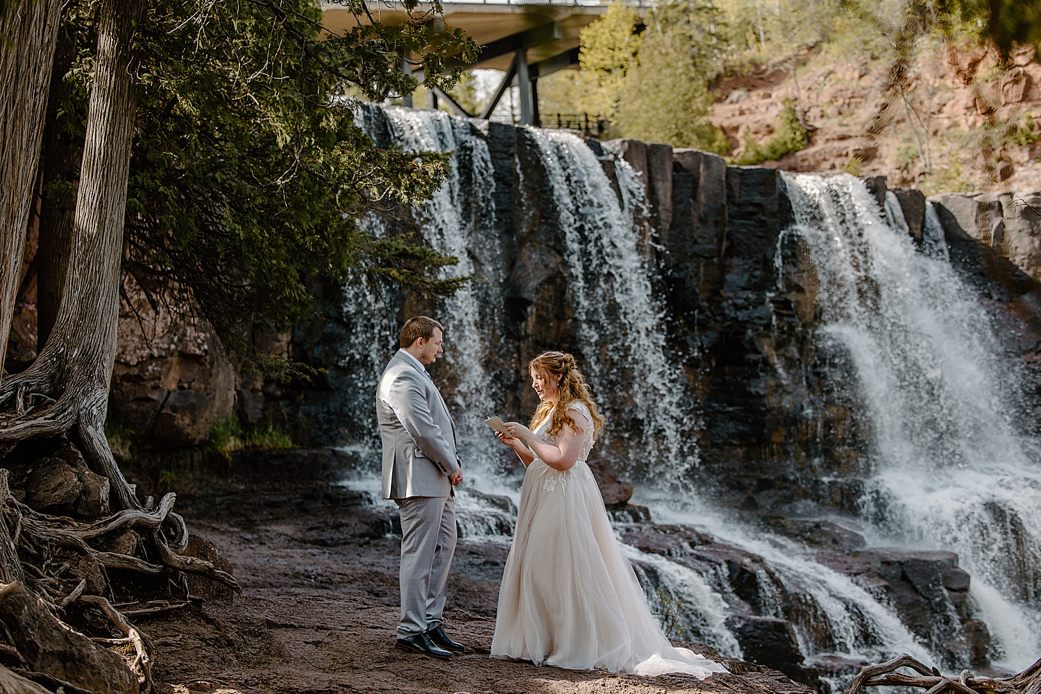 couple share private vows during the best time to elope at gooseberry falls state park