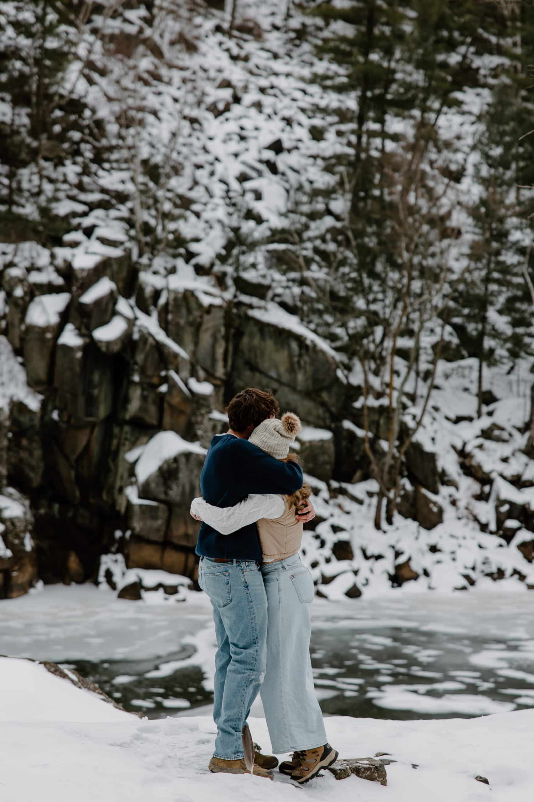 couple hug together in the snow for Interstate State Park Winter Proposal