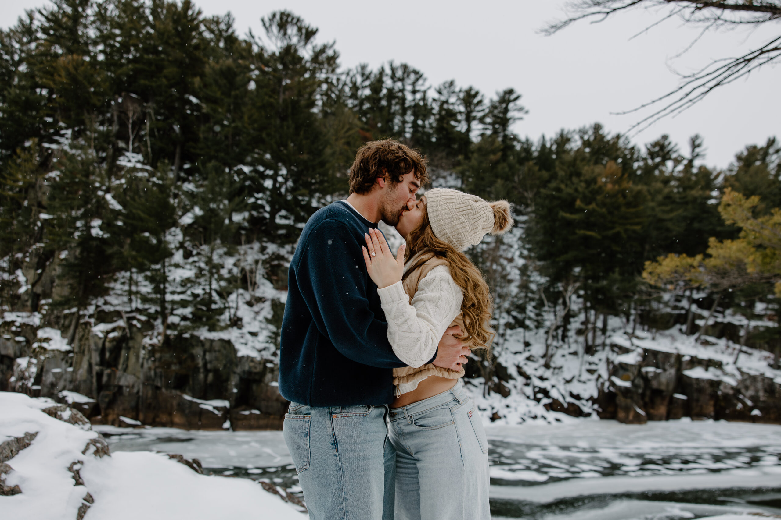 husband and wife-to-be kiss outside for Interstate State Park Winter Proposal