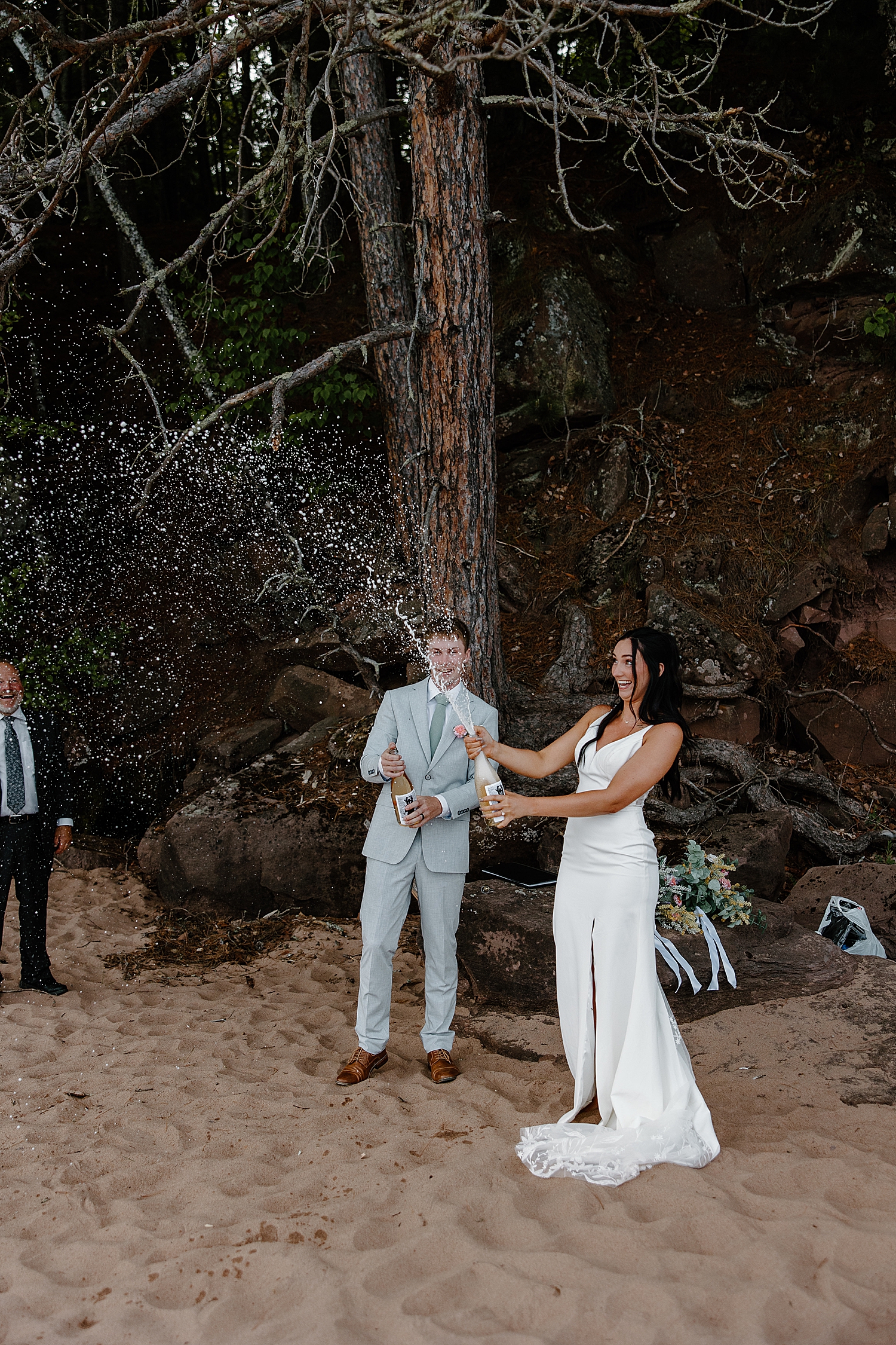 bride splashes champagne by Samantha Burke Photography