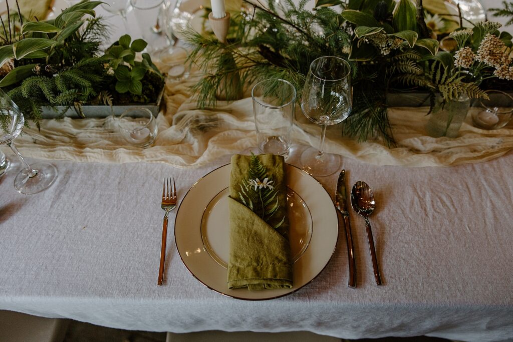 table setting with foraged plants by Wisconsin wedding photographer
