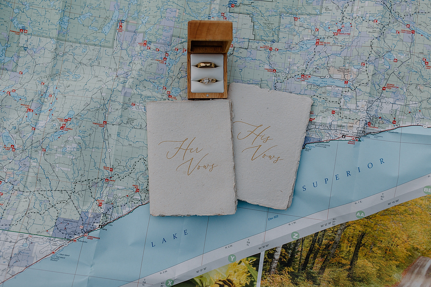 handmade vow books on map of lake superior by Samantha Burke Photography